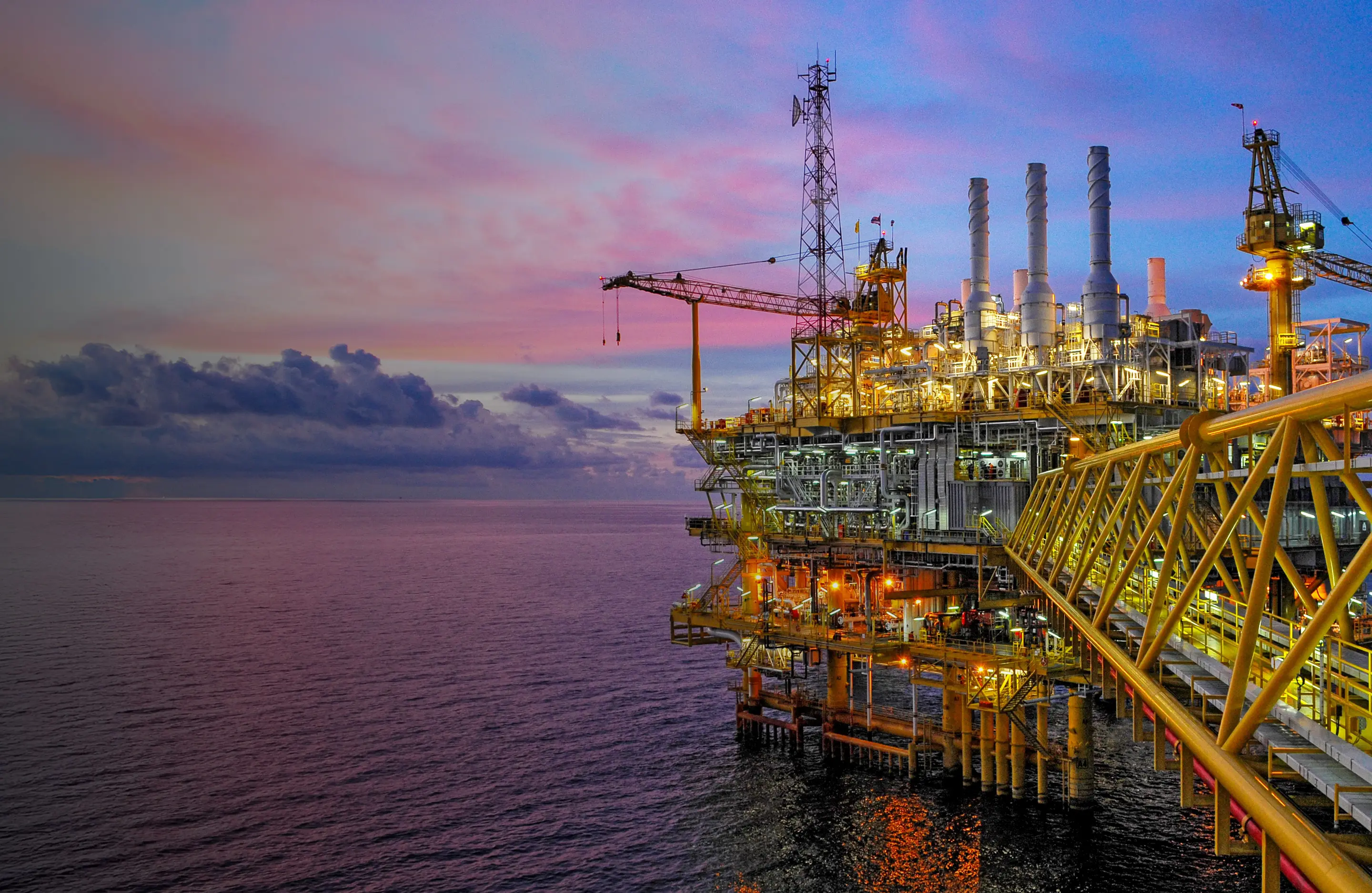 Offshore oil and gas platform at dusk